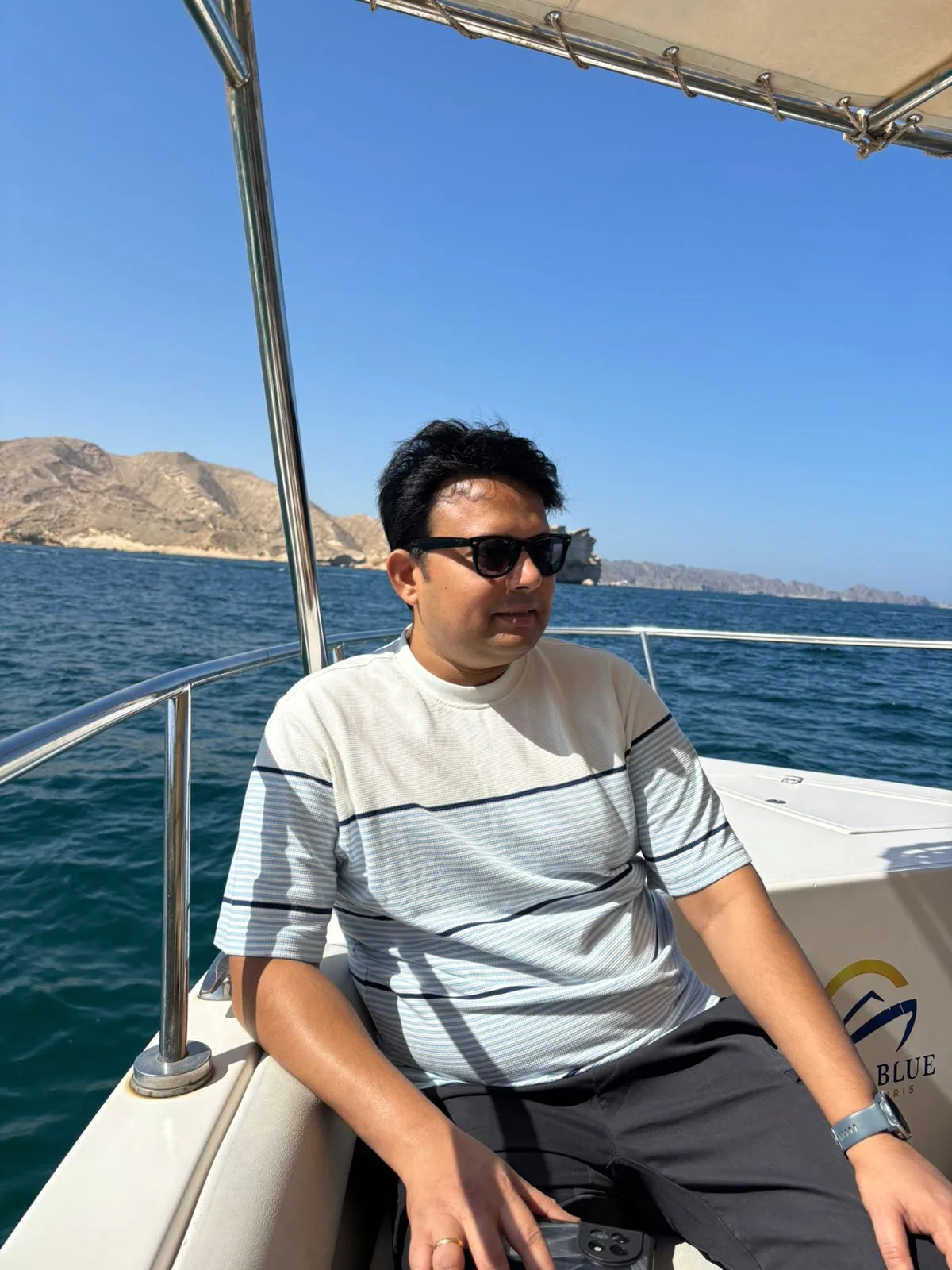 Founder on a boat at sea during a travel experience